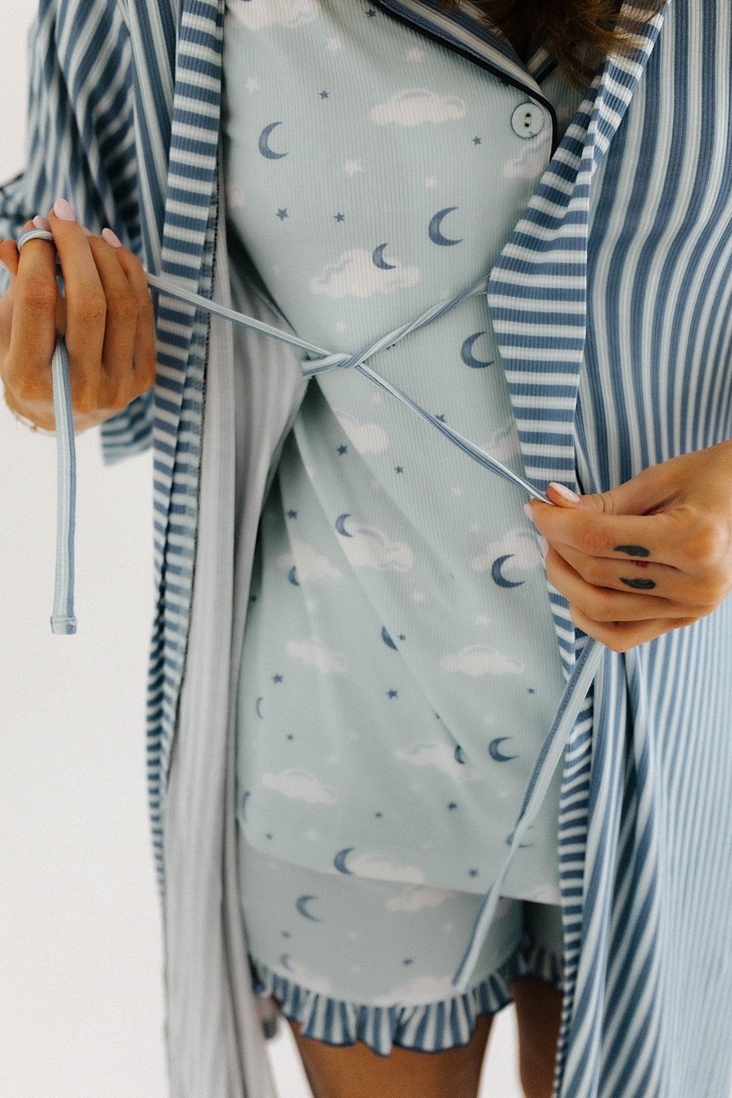model showing inner ties on blue striped robe 