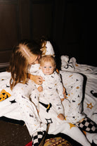 Baby Halloween Icon Pointelle Zip Pajamas shown in a full length lifestyle view