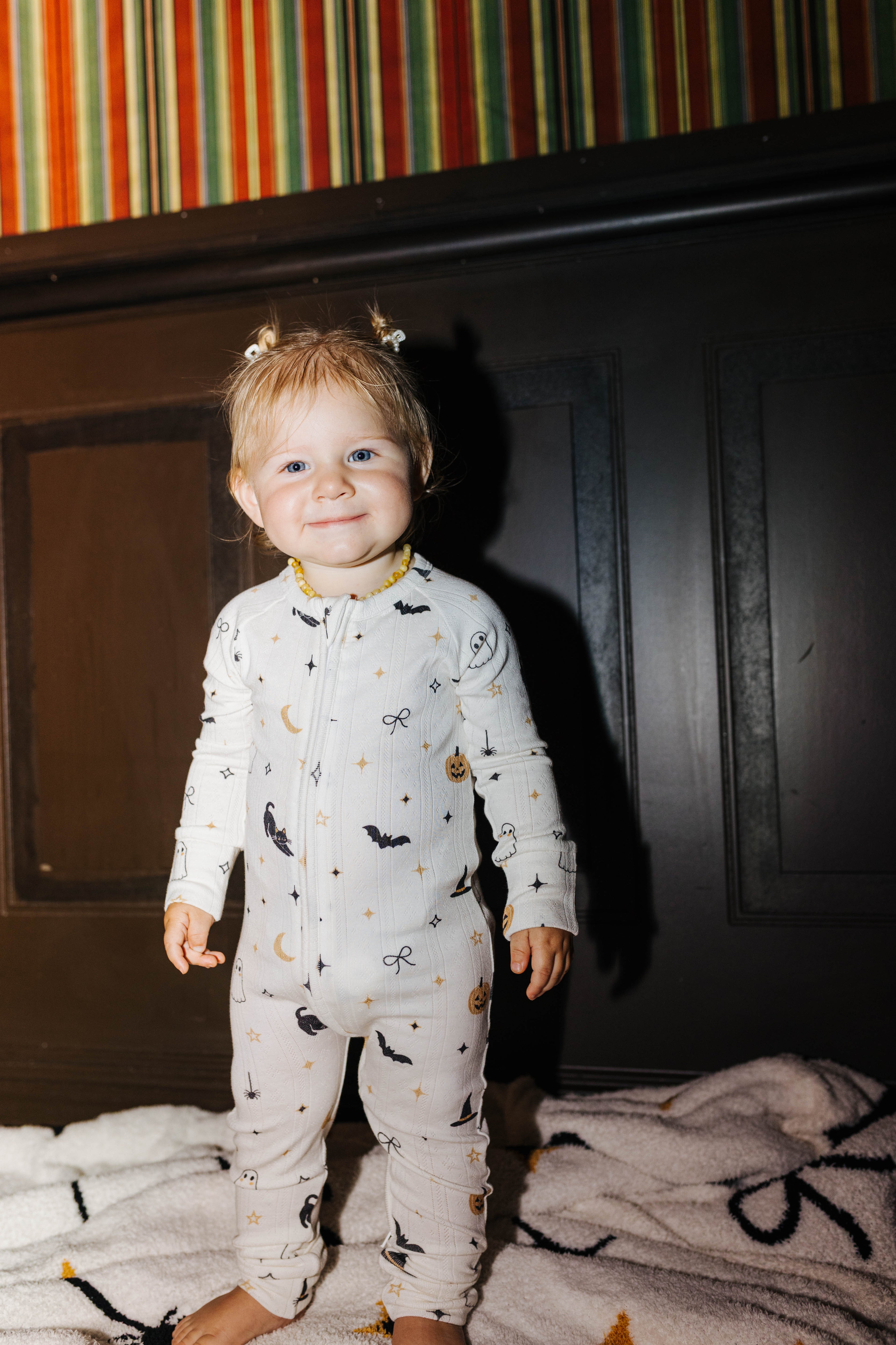 Baby Halloween Icon Pointelle Zip Pajamas styled in the Halloween campaign setting