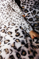 Close view of the zipper on baby leopard pajamas
