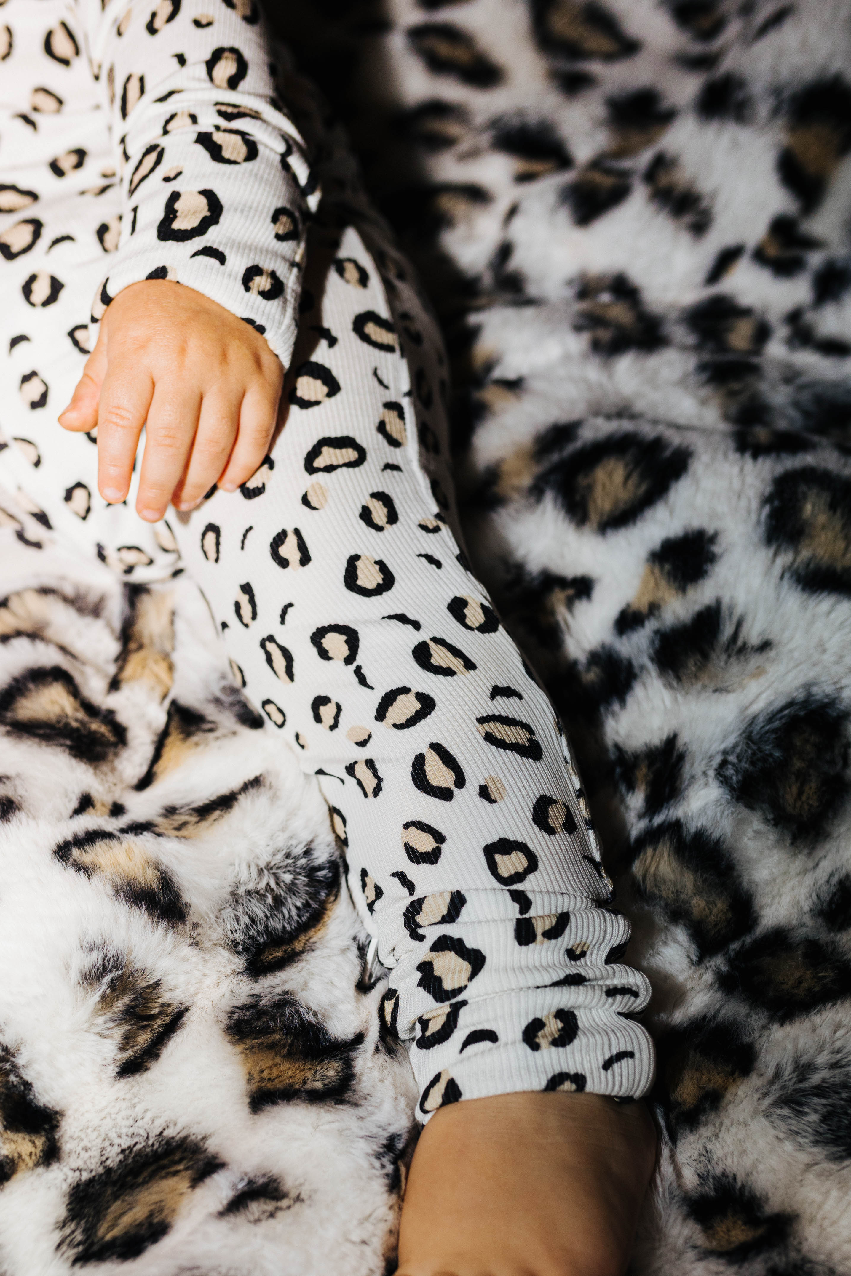Baby Leopard Ribbed Zip Pajamas shown in a full length lifestyle view