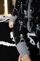 Close view of the zipper on baby Skelly pajamas