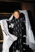 Skelly Blanket 60x80 shown in a full length lifestyle view