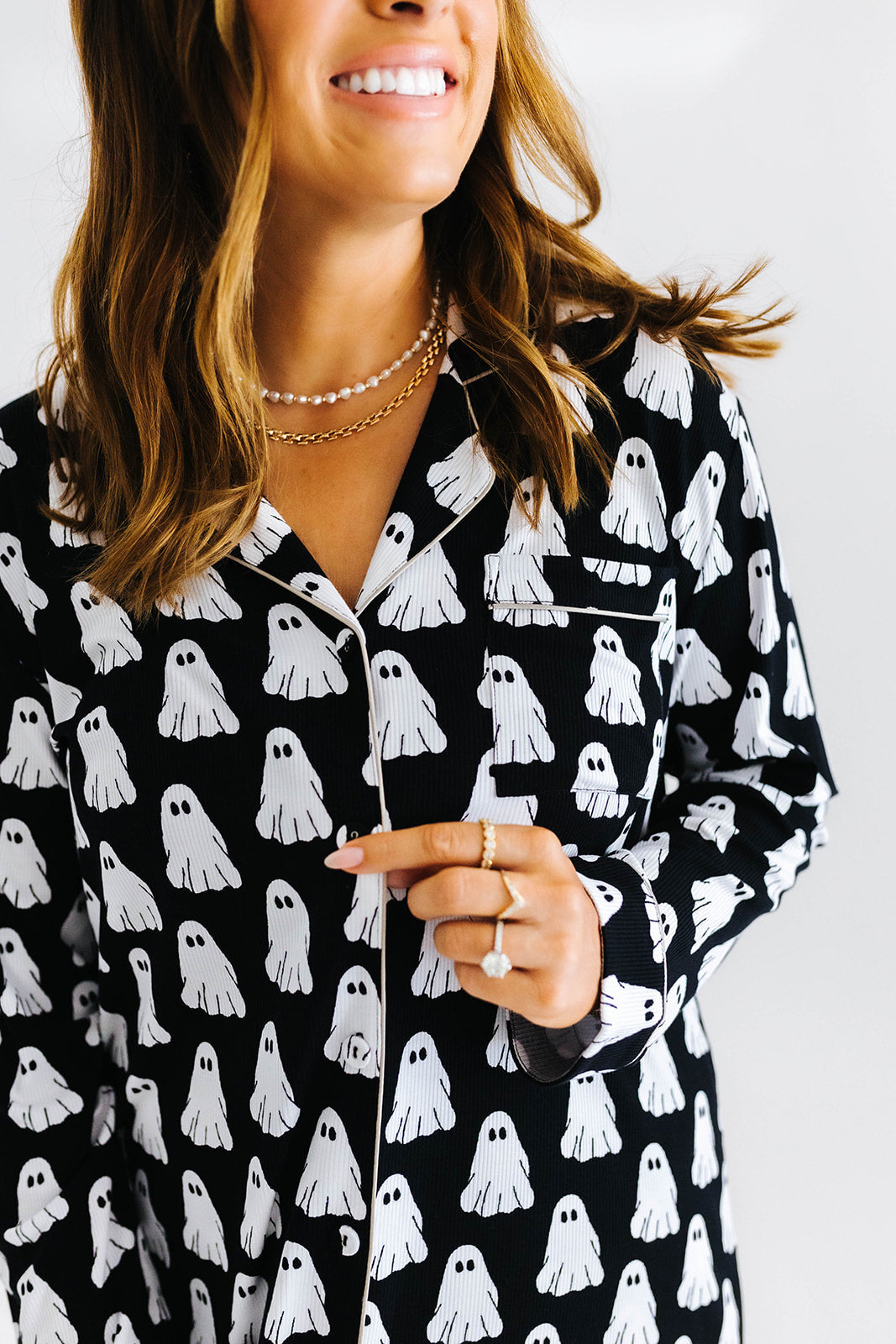 model smiling showing the ghost pajama top