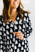 model smiling showing the ghost pajama top