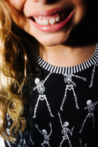 Striped neckline detail on kids Skelly pajamas