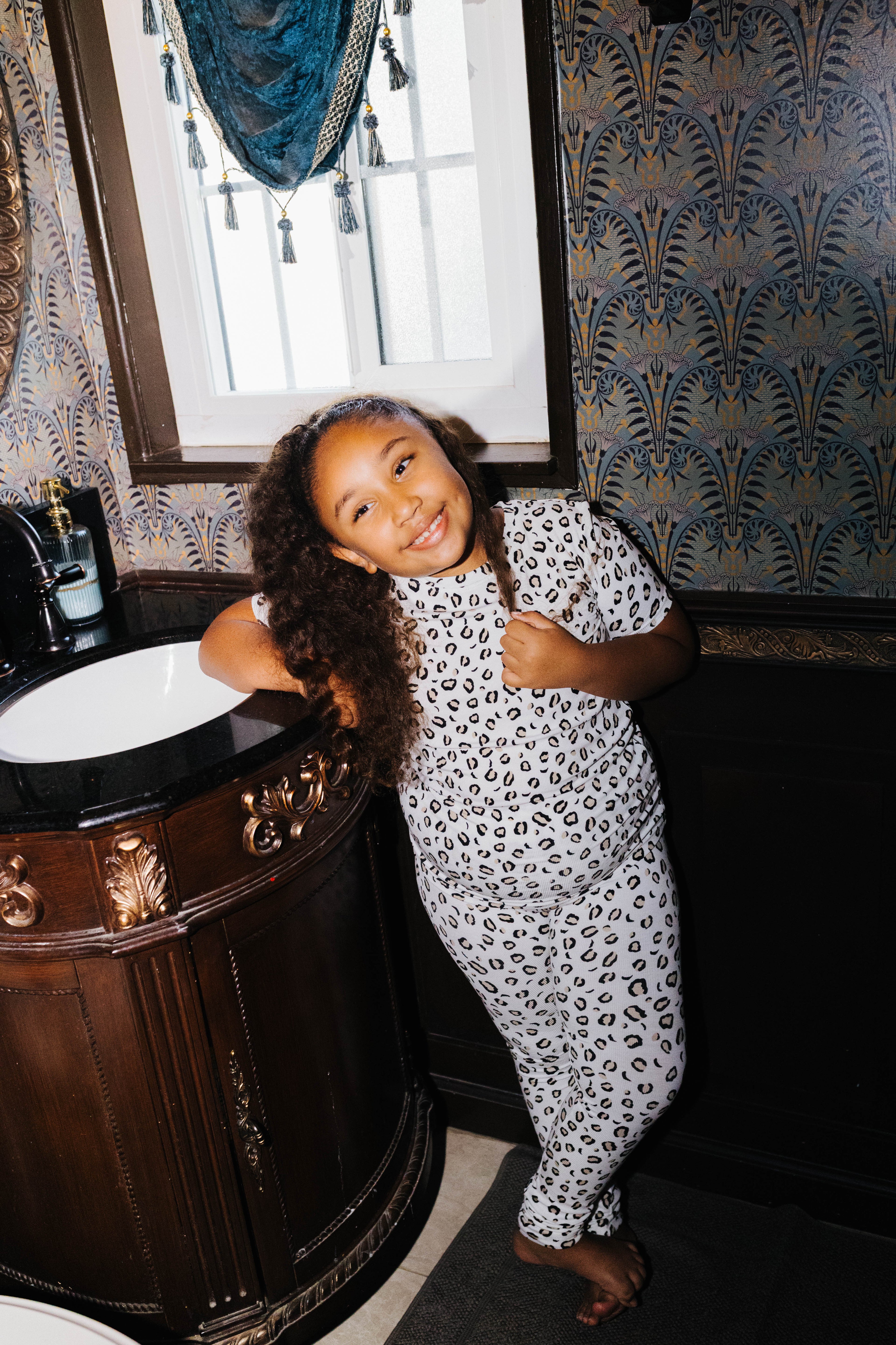 Kid Leopard Ribbed Pajama Set shown in a full length lifestyle view