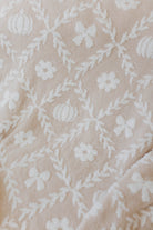 close up of the pumpkin blanket print with pumpkins, flowers, and bows