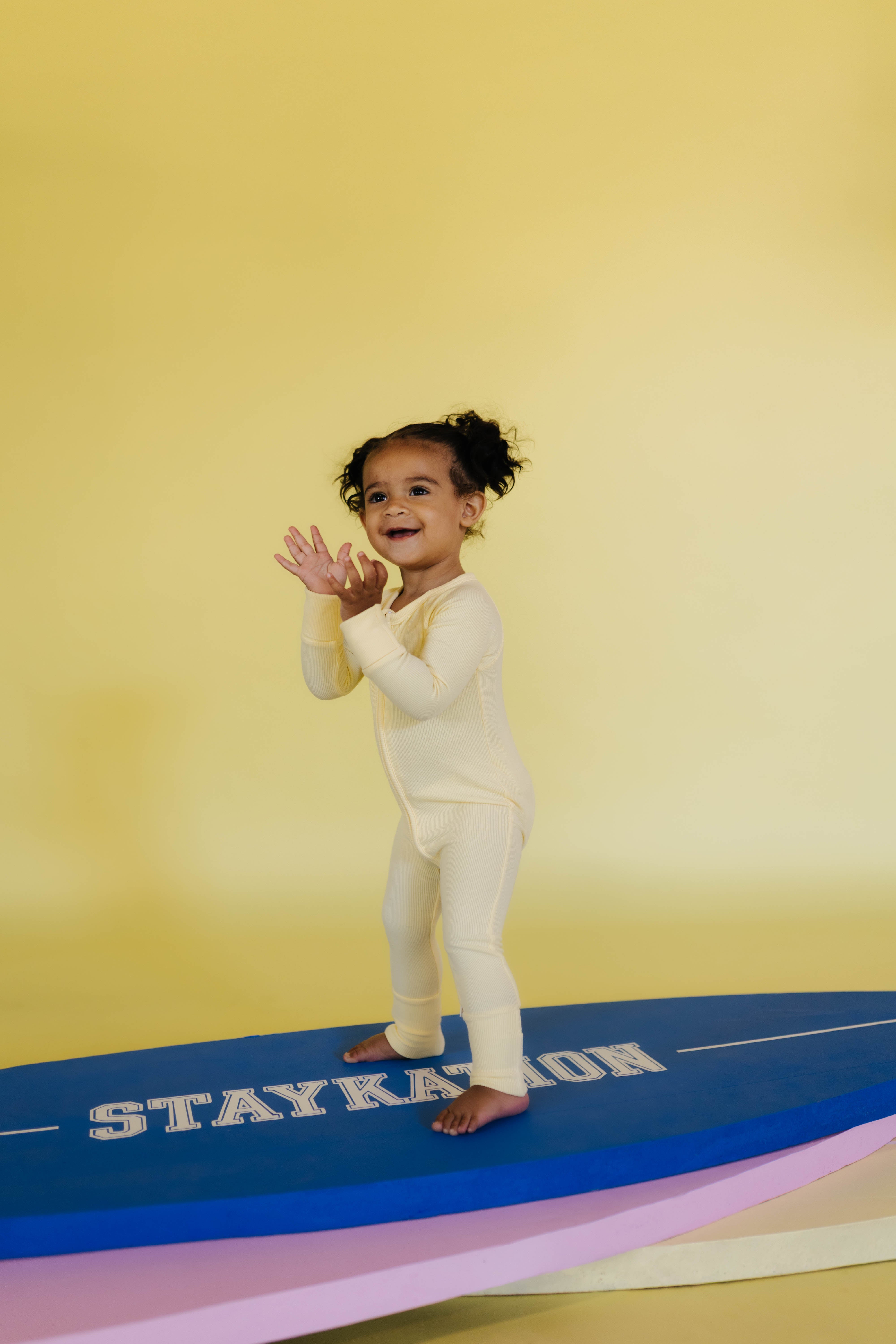 journie standing on the surfboards