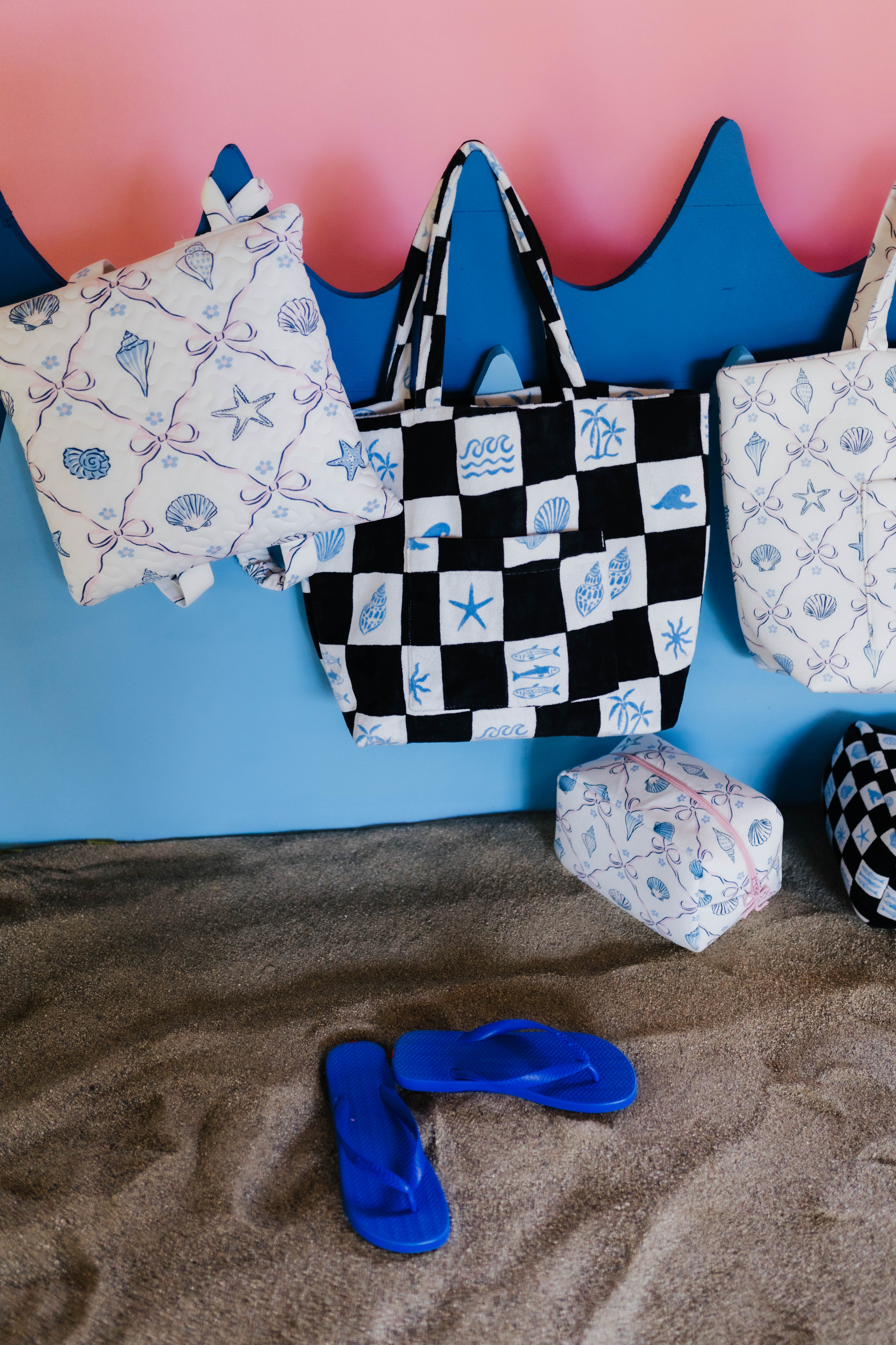 tote bags with sand underneath them 