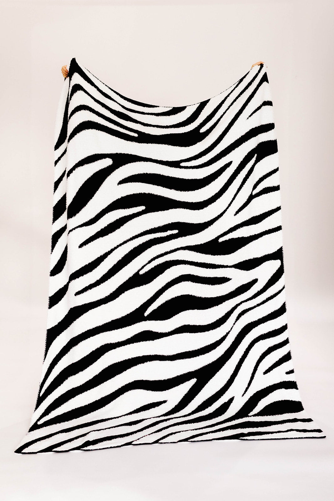 Black and white zebra-striped fabric on a white background