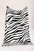 Black and white zebra-striped fabric on a white background