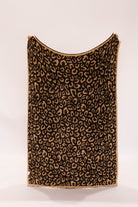 Leopard print blanket on a white background