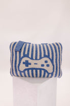 Blue and white striped gaming quillow with a game controller design on a white background