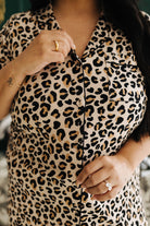 Person wearing a leopard print pjs with a blurred background