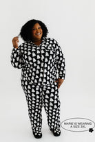 model mari smiling wearing the size 3x in the ghost pajamas
