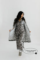 model lynds wearing the size small in the skelly pajamas and skelly ribbed robe 