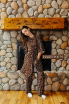 Sizing photo: Haley in S/M wearing the brown bow print robe over matching pajamas.