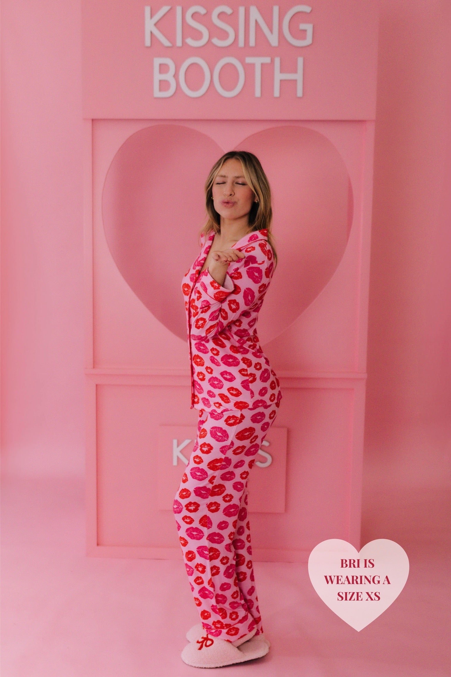 Bri in the XS kiss pjs blowing a kiss at the camera