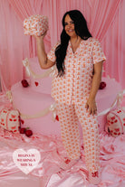 Regina holding the cosmetic bag in her hands smiling and posing