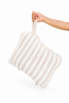 holding striped quillow by their hand