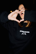 Adult Spooky Season Sweatshirt shown in a full length lifestyle view