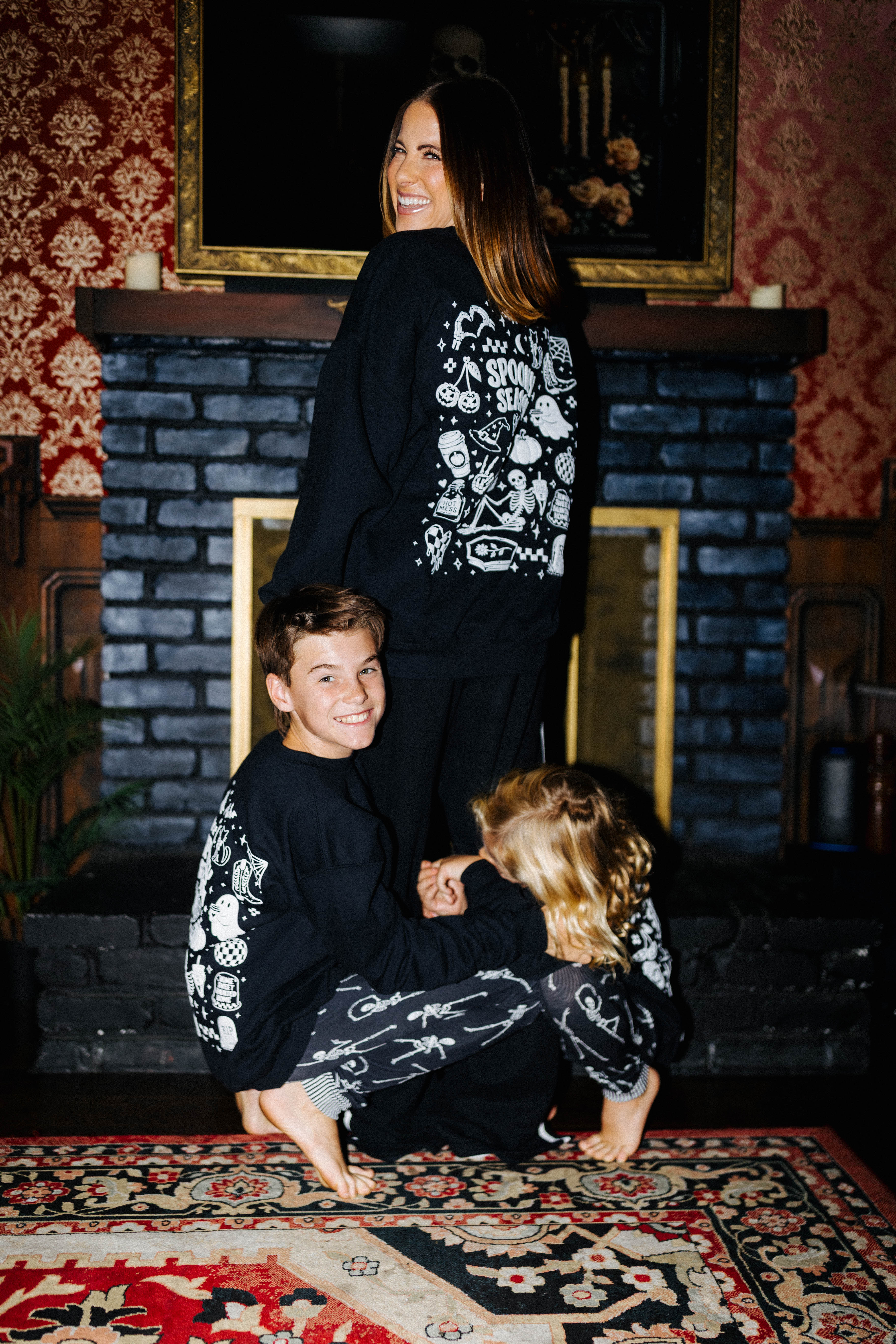Kid Spooky Season Sweatshirt styled in the Halloween campaign setting