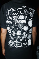 Halloween graphic on the back of the Spooky Season tee