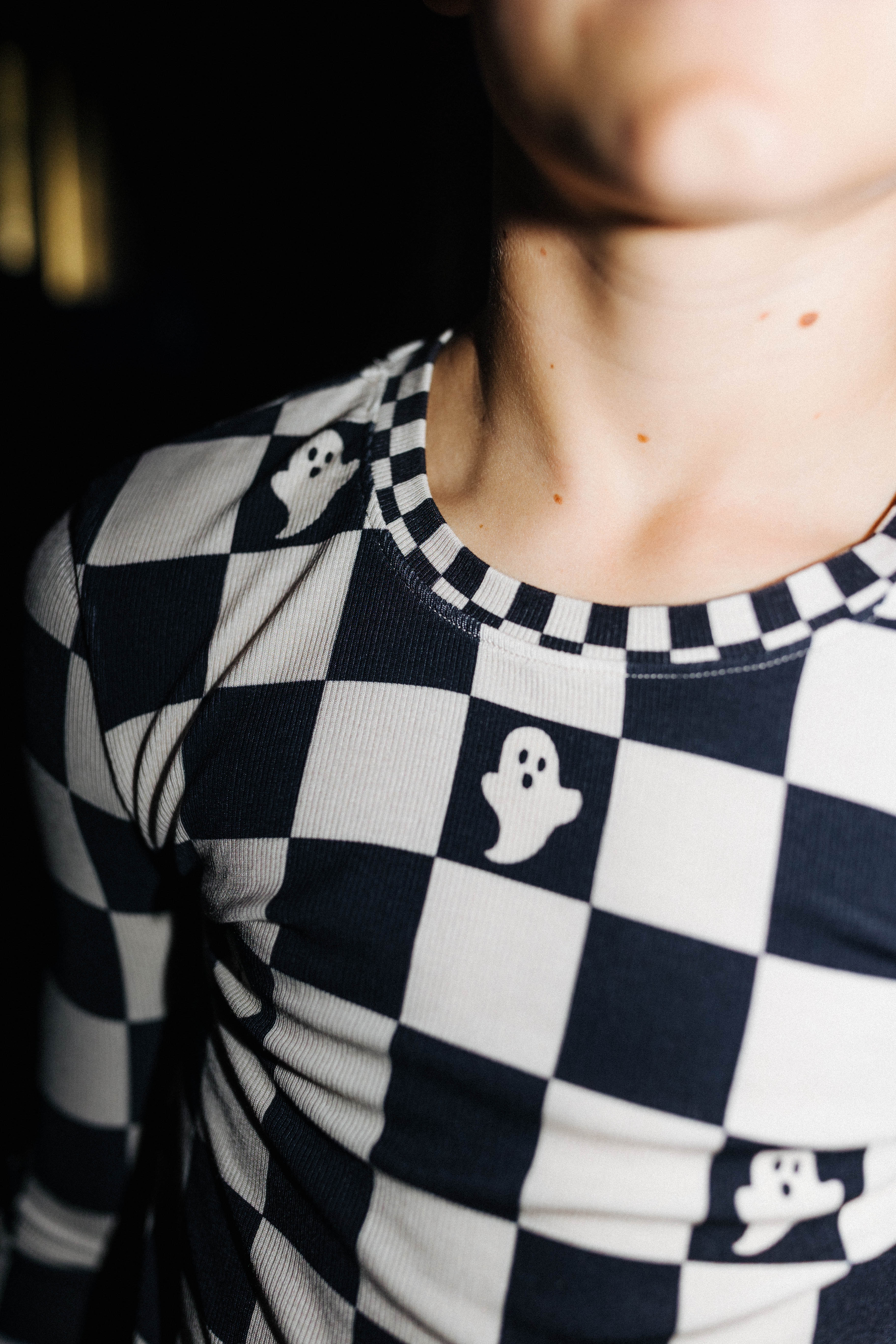 Close view of the check neckline on kids Ghost Check pajamas