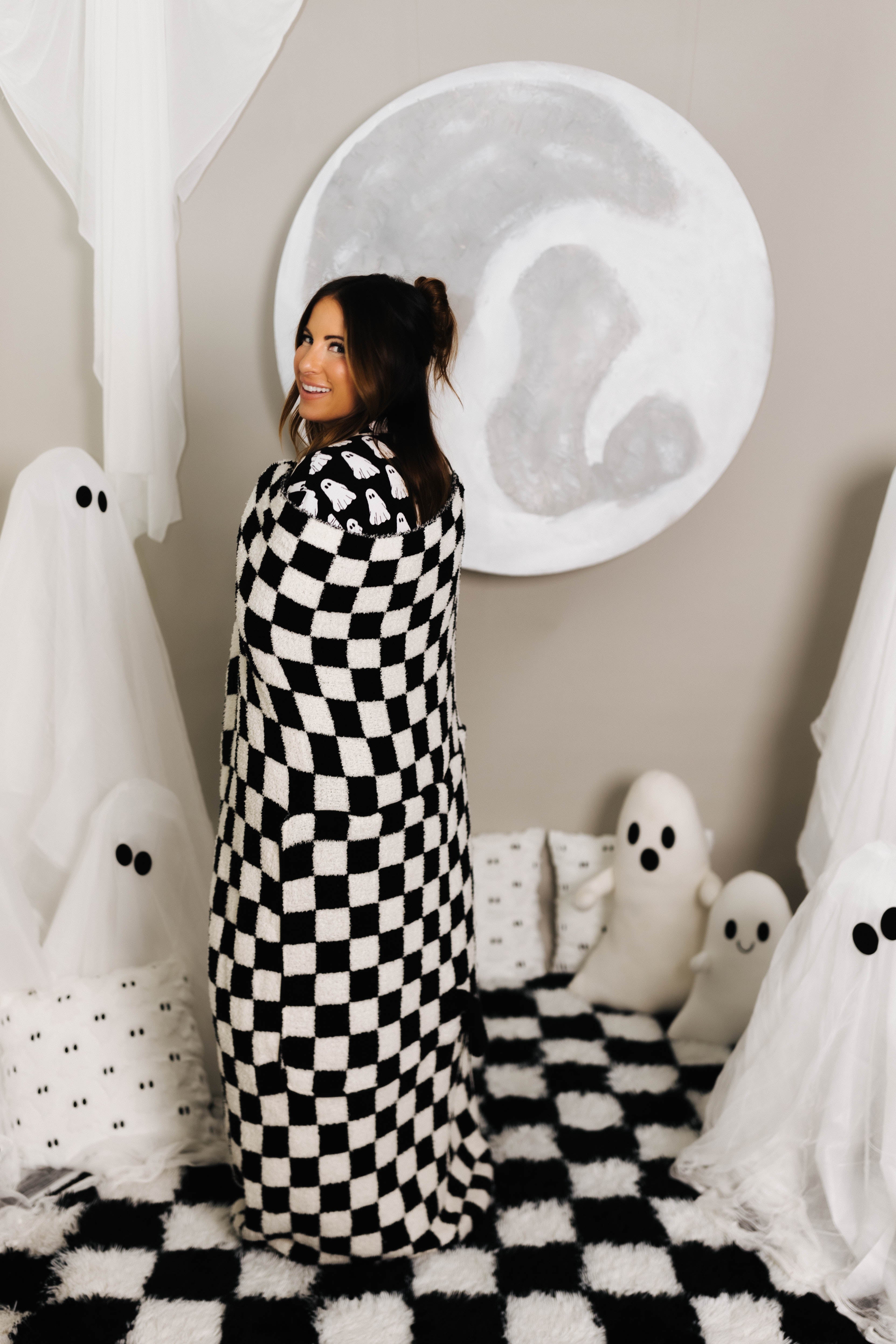 model krista smiling with black check quillow opened smiling with quillow opened and wrapped around her 