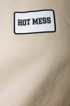 Hot Mess patch on sand sweatshirt