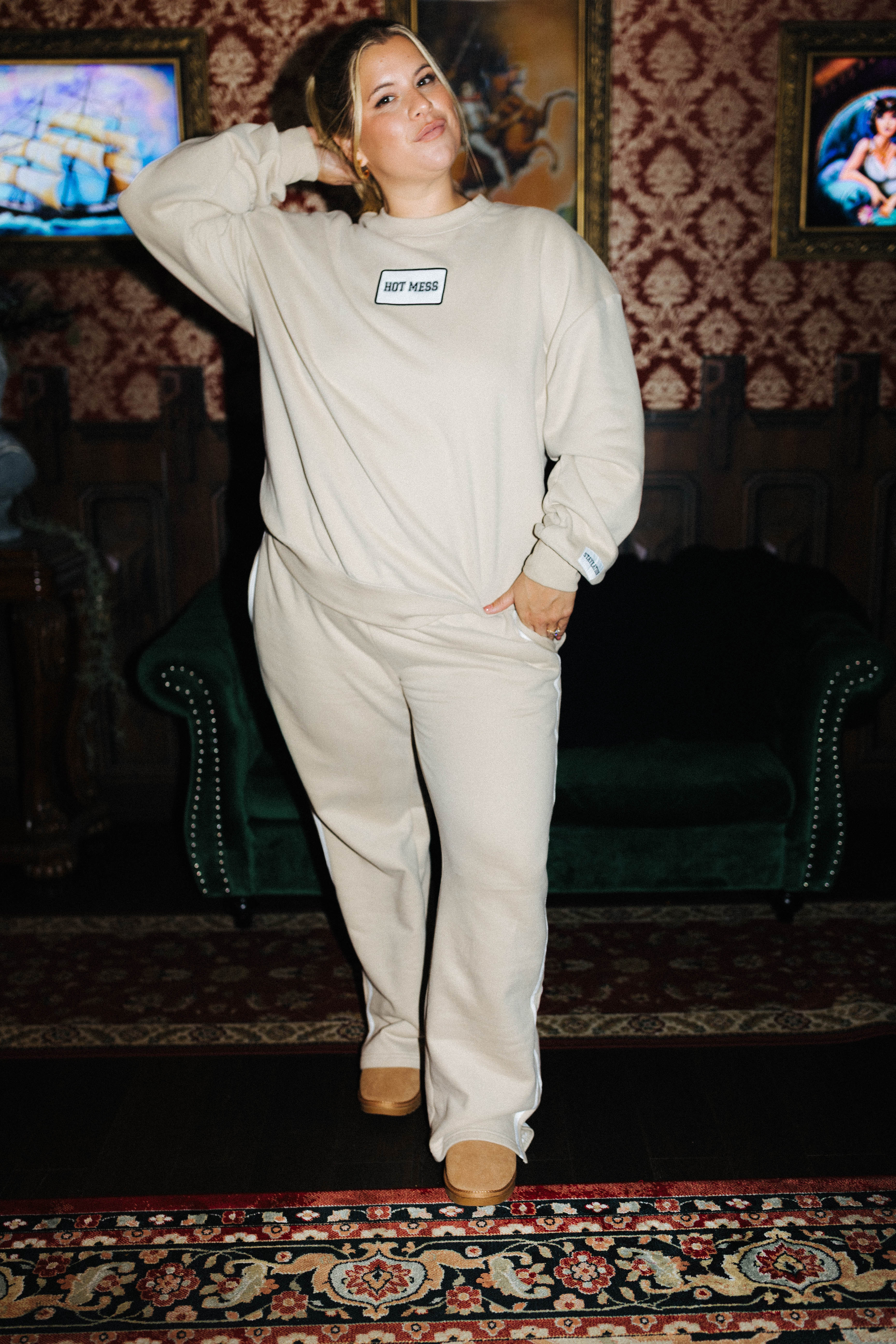 Staykation Halloween collection lifestyle photo featuring Tan 100% Cotton Hot Mess Patch Sweatshirt and Tan 100% Cotton Sweatpants
