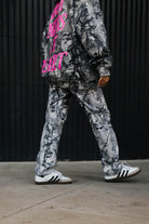 model wearing hot mess at heart camo set walking away showing lower half of camo sweatpants 