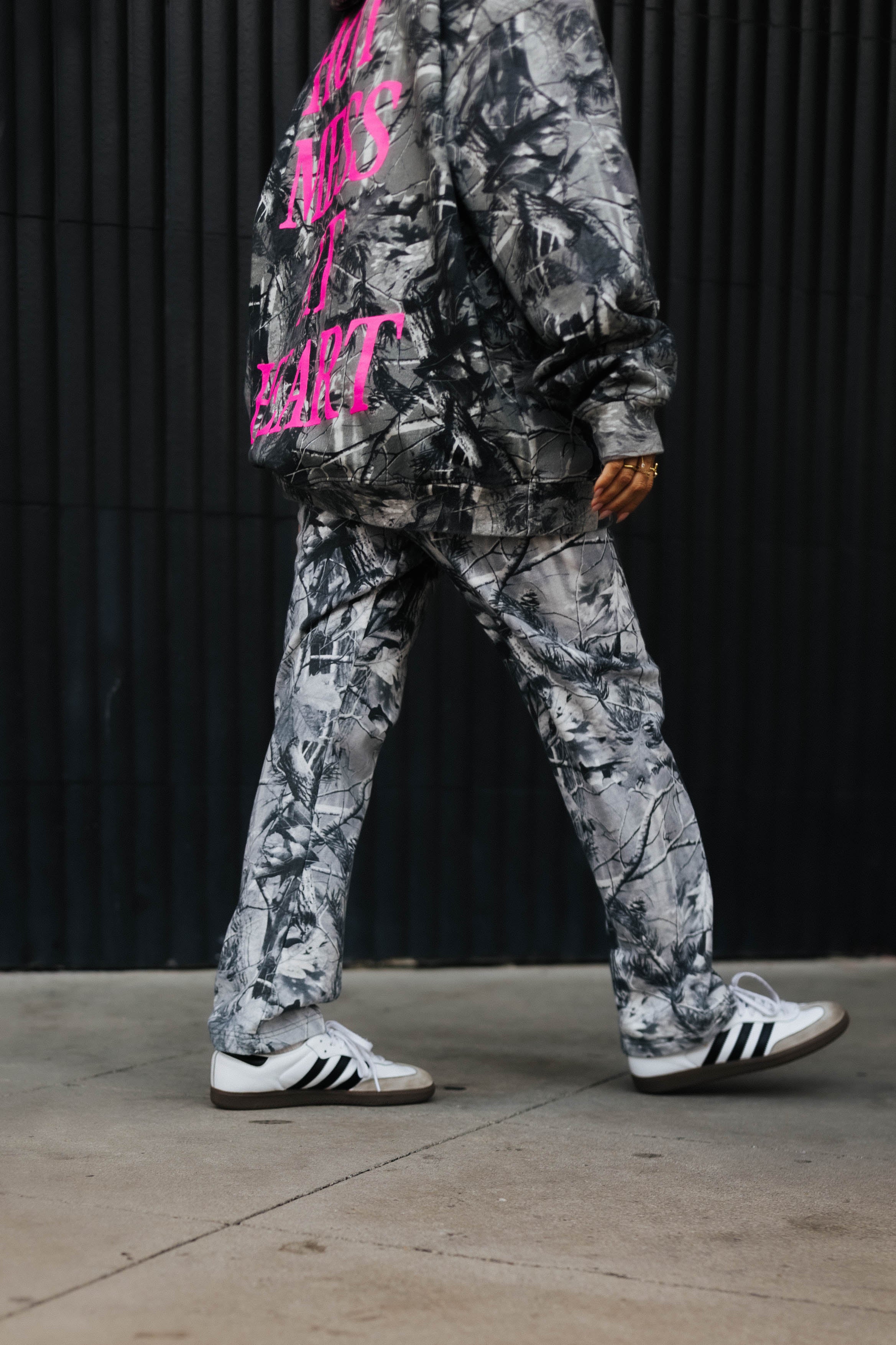 model wearing hot mess at heart camo set walking away showing lower half of camo sweatpants 