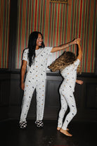Adult and child in matching Halloween Icon Print pajamas