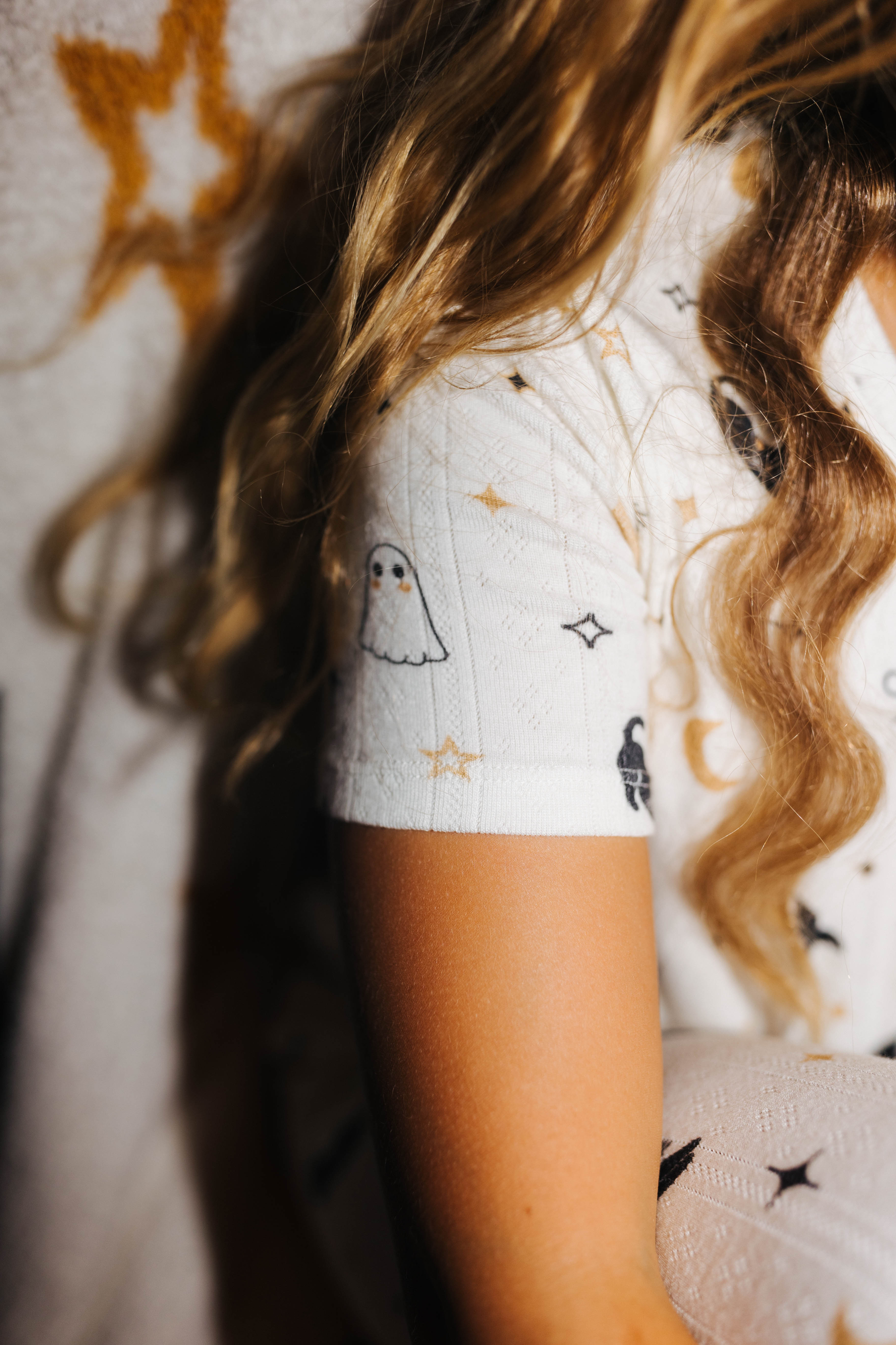 Close view of the sleeve on kids Halloween Icon Print pajamas