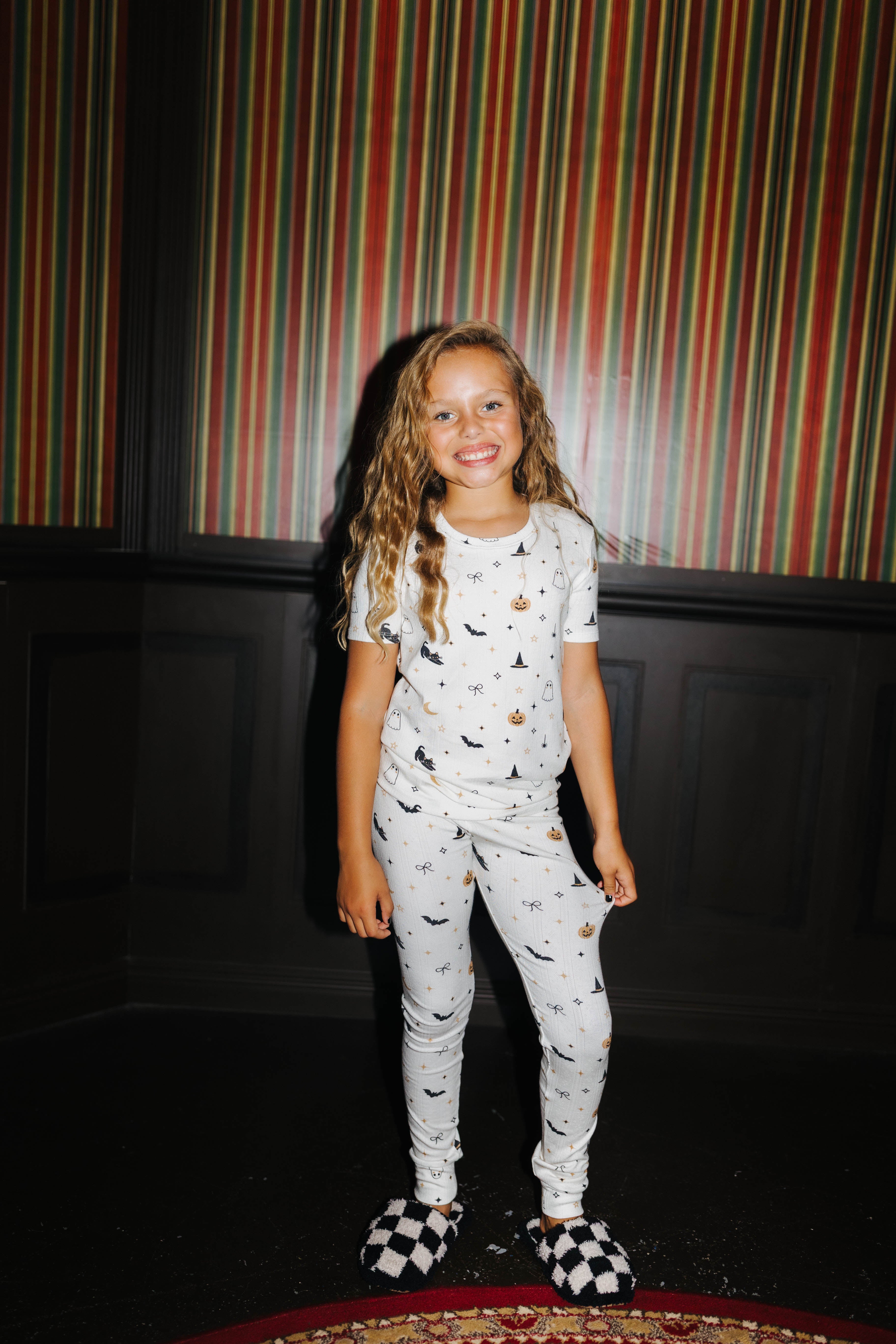 Front view of kids Halloween Icon Print pajamas with long pants