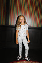 Front view of kids Halloween Icon Print pajamas with long pants