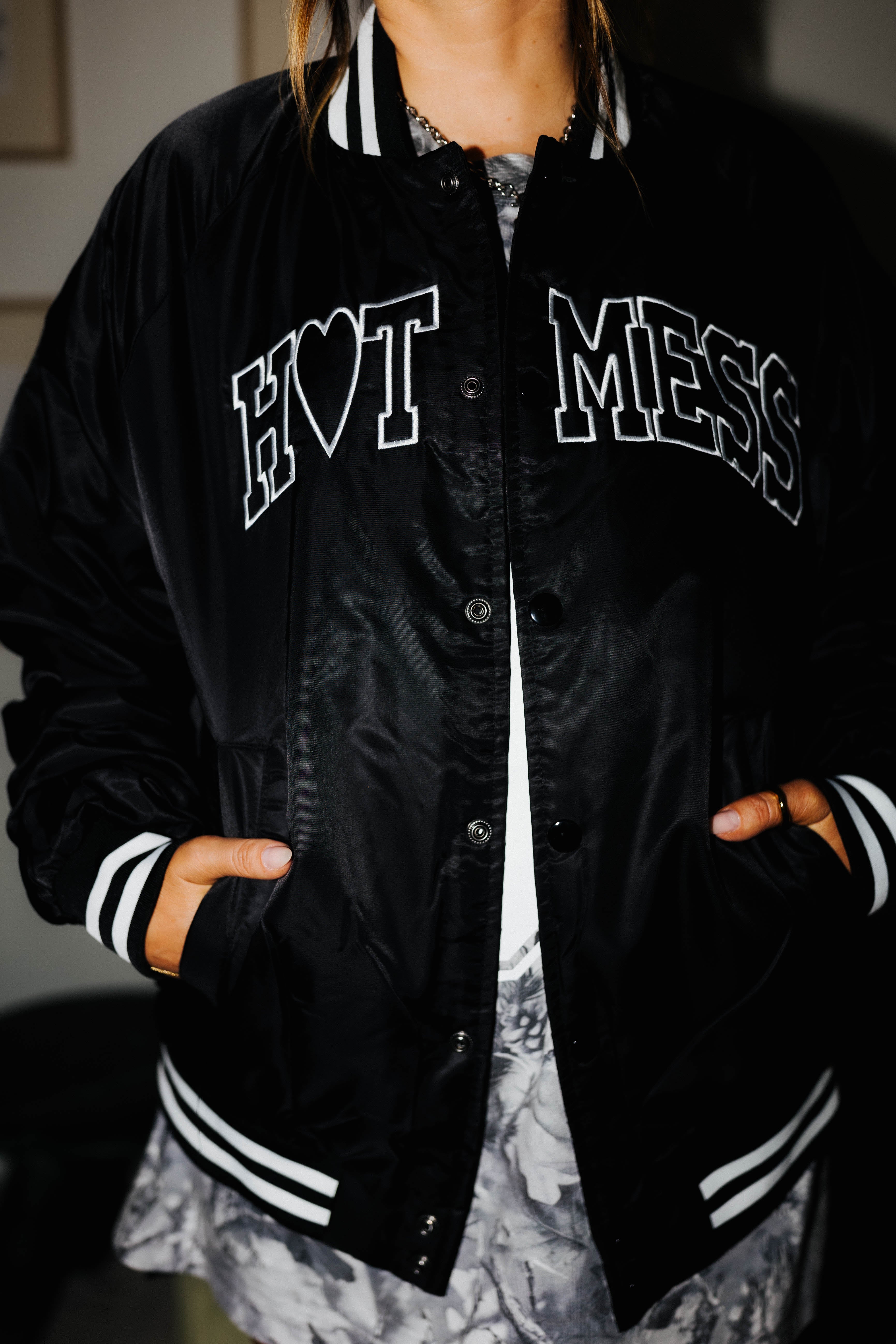 model wearing hot mess bomber jacket with hands in pockets