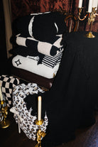 Black Waffle Fringe Blanket 90x90 shown from an alternate angle