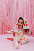 baby with the blanket on their head