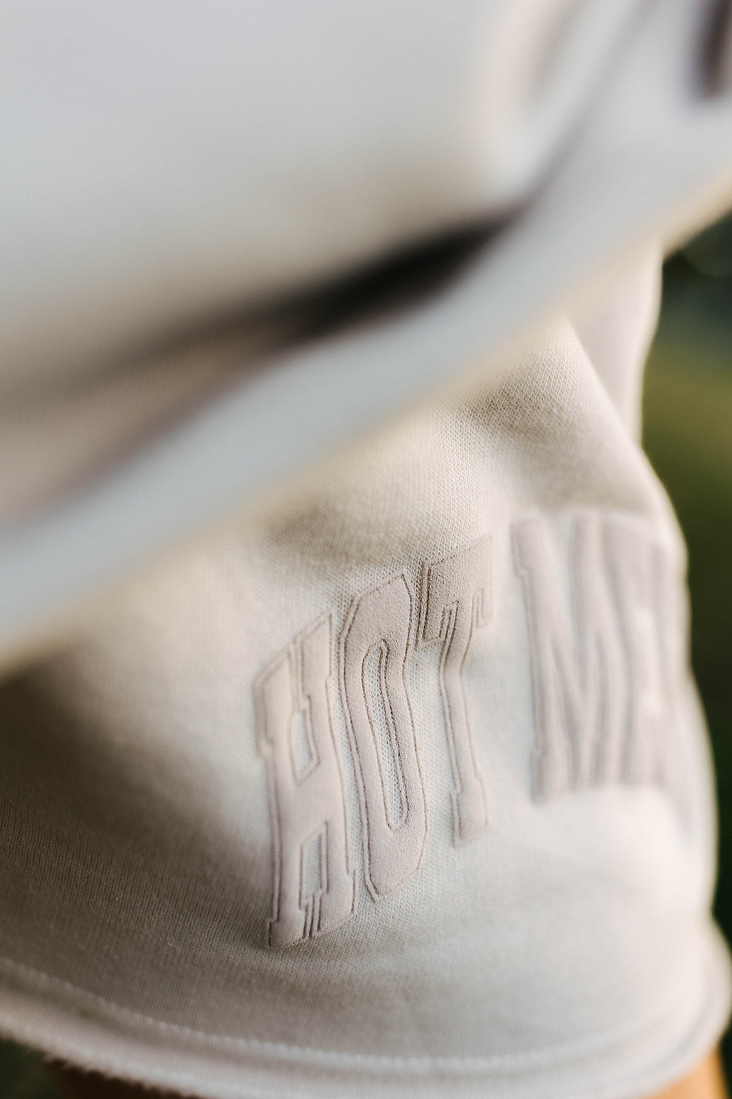 Close-up of shorts with hot mess puff print