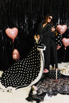 Kolly hugging Krista while she holds the black and white heart blanket