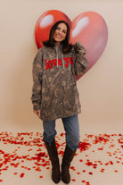 Krista in an XL camo sweatshirt that says love you in red puff print