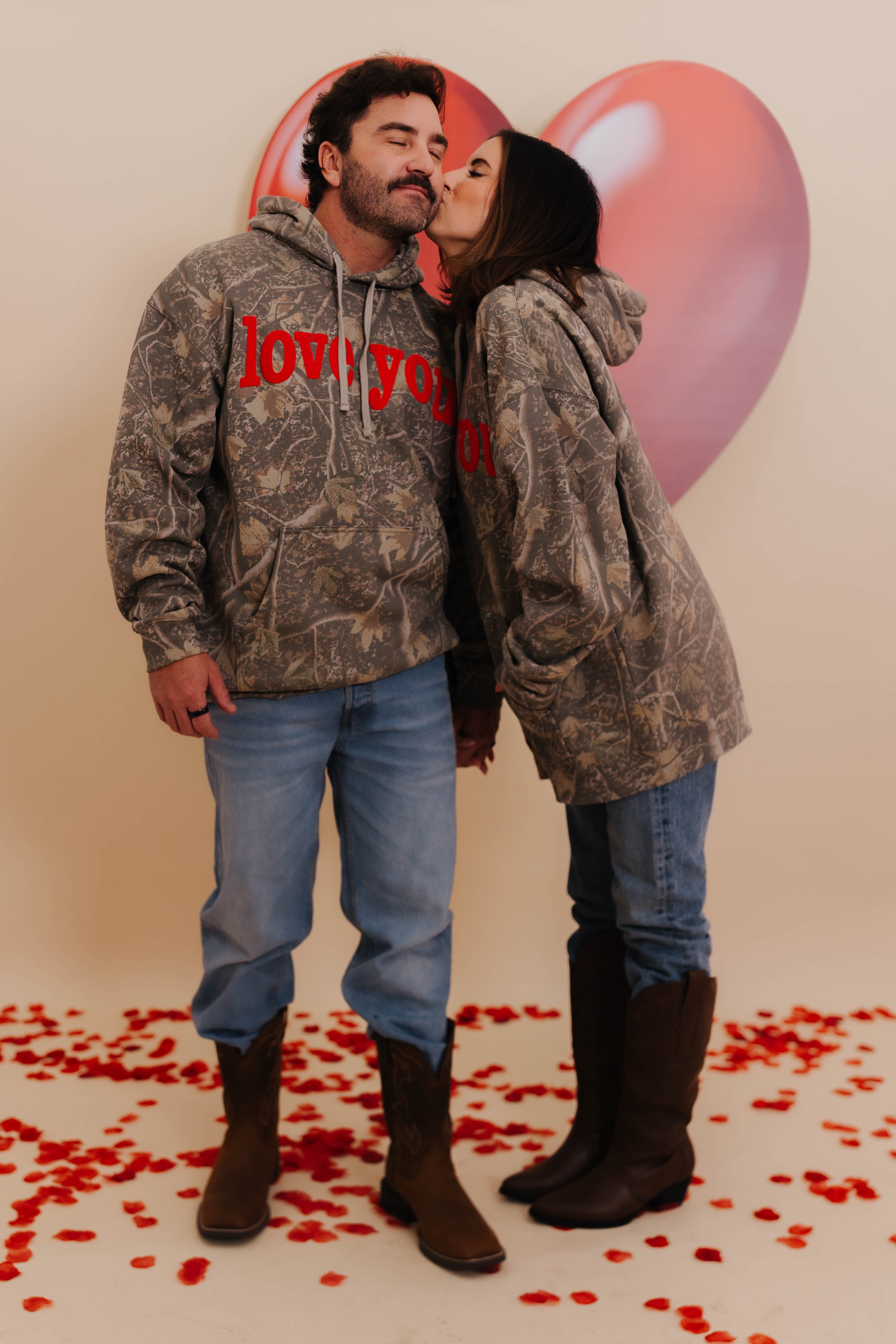 Krista giving Bryce a kiss on the cheek