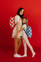 Krista and Kolly holding hands with the quillows