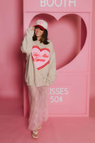 Krista smiling and nodding to her hat 