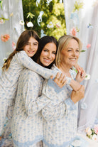 Kolly, Krista, and Dena smiling in floral pjs