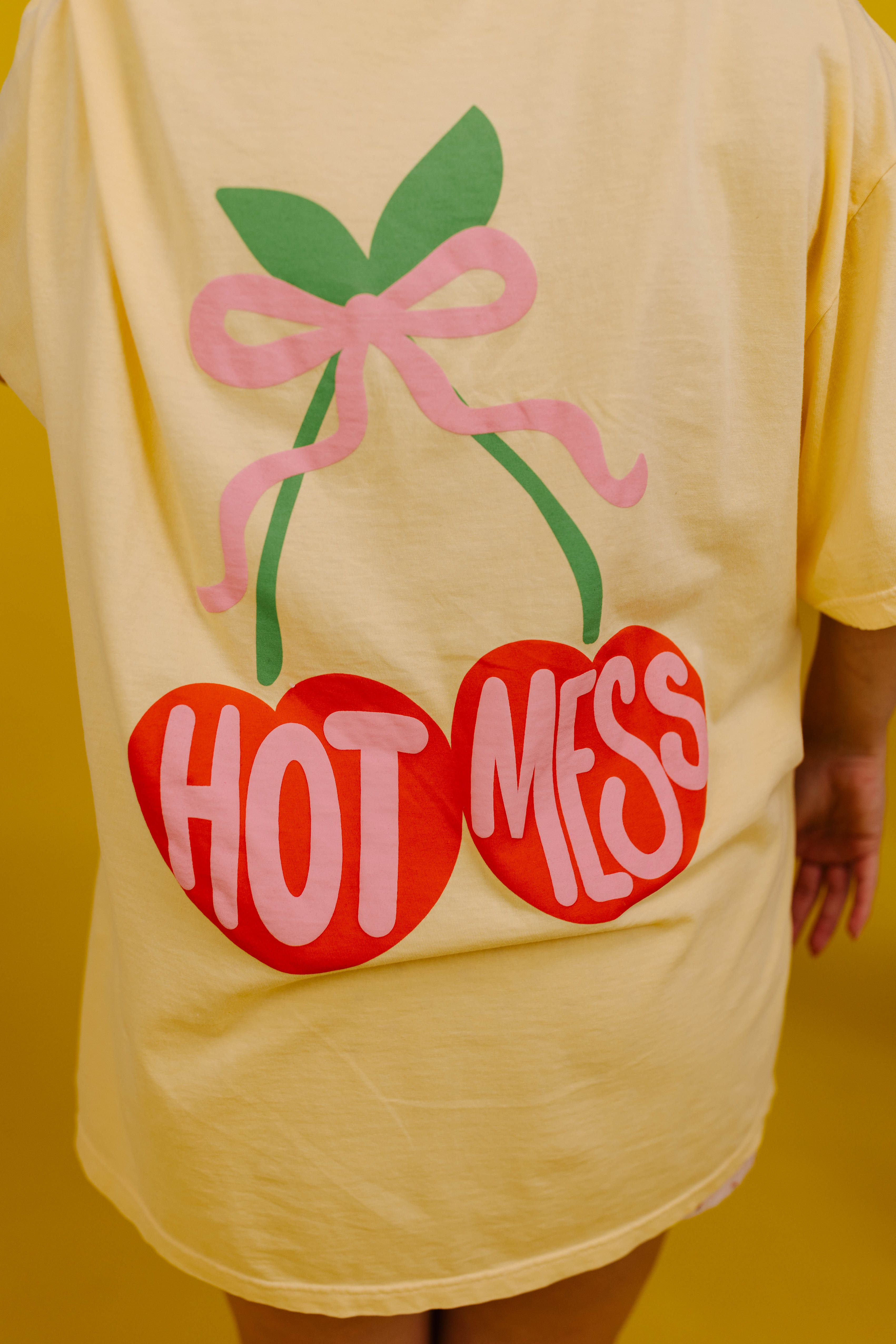Yellow t-shirt with 'Hot Mess' design on a yellow background