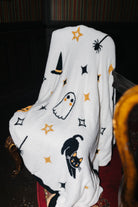 Halloween Icon Print blanket draped over a chair